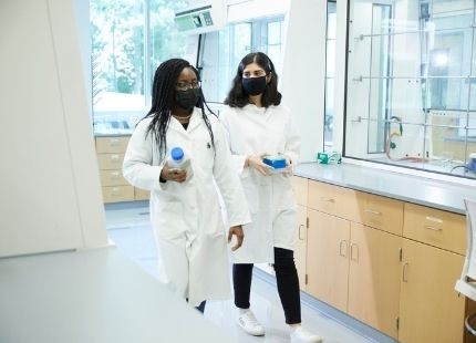 Two students in the food science lab
